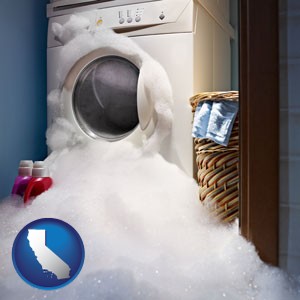 a washing machine with overflowing soap suds in a laundry - with California icon