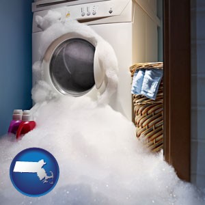 a washing machine with overflowing soap suds in a laundry - with Massachusetts icon