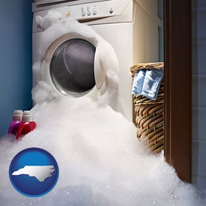 a washing machine with overflowing soap suds in a laundry - with North Carolina icon