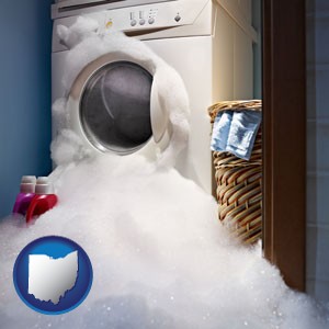 a washing machine with overflowing soap suds in a laundry - with Ohio icon