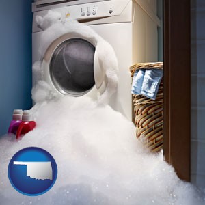 a washing machine with overflowing soap suds in a laundry - with Oklahoma icon