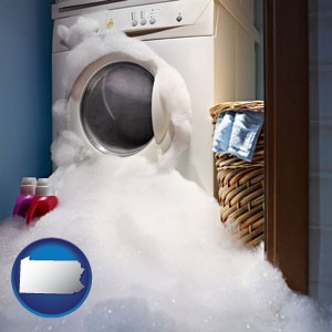 a washing machine with overflowing soap suds in a laundry - with Pennsylvania icon