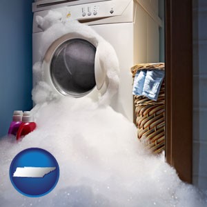 a washing machine with overflowing soap suds in a laundry - with Tennessee icon